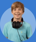 GCSE student wearing a blue top and smiling, on a blue circle background.