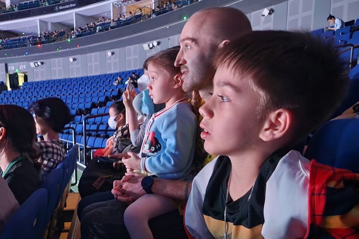 Primary school student Jake with his family at an event