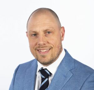 Studio portrait of King's InterHigh SEN Lead, Ray Boxall, against a white background.