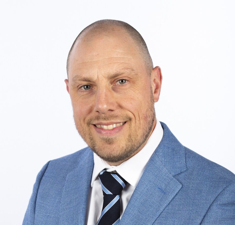 Studio portrait of King's InterHigh SEN Lead, Ray Boxall, against a white background.